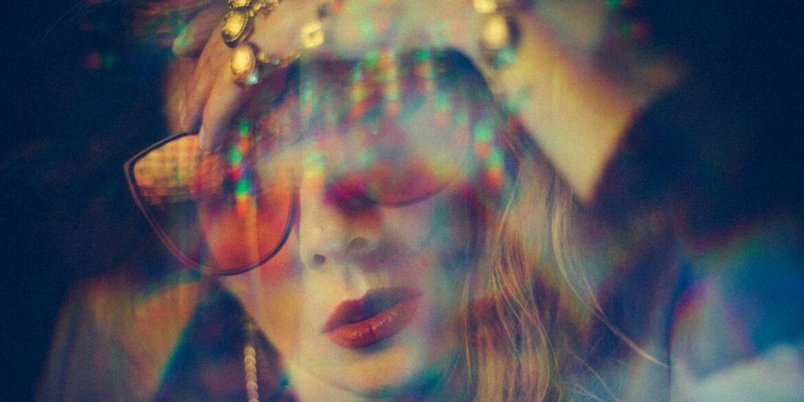 woman wearing sunglasses and red lipstick