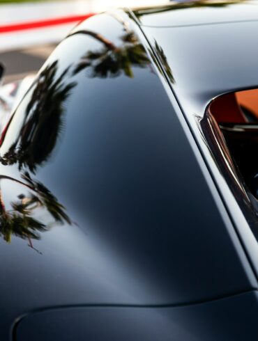 A close up of a car parked on the side of the road