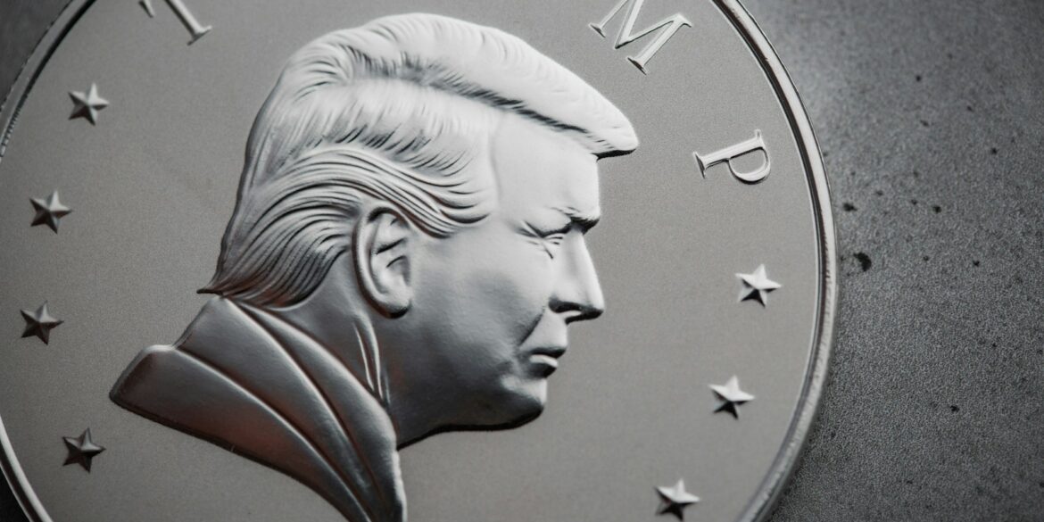 a close up of a silver coin with a picture of president donald