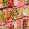 A shelf filled with lots of different types of food