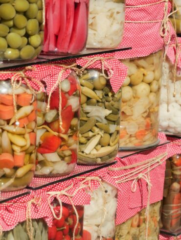 A shelf filled with lots of different types of food