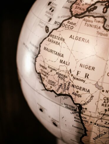 white and brown desk globe