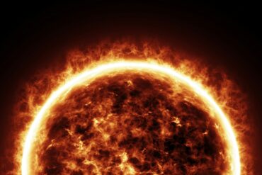 a bright sun is shown in the dark sky