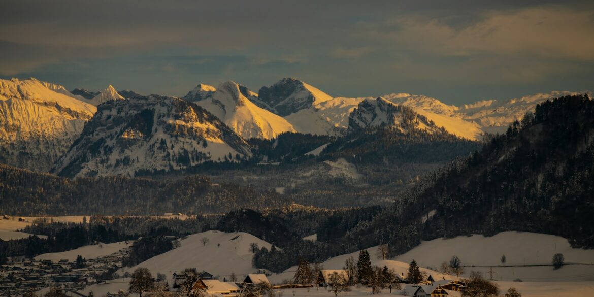 snow covered mountain during daytime