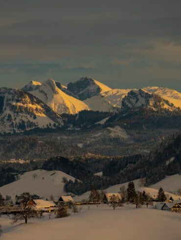 snow covered mountain during daytime