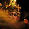 A woman wearing a headdress and a crown