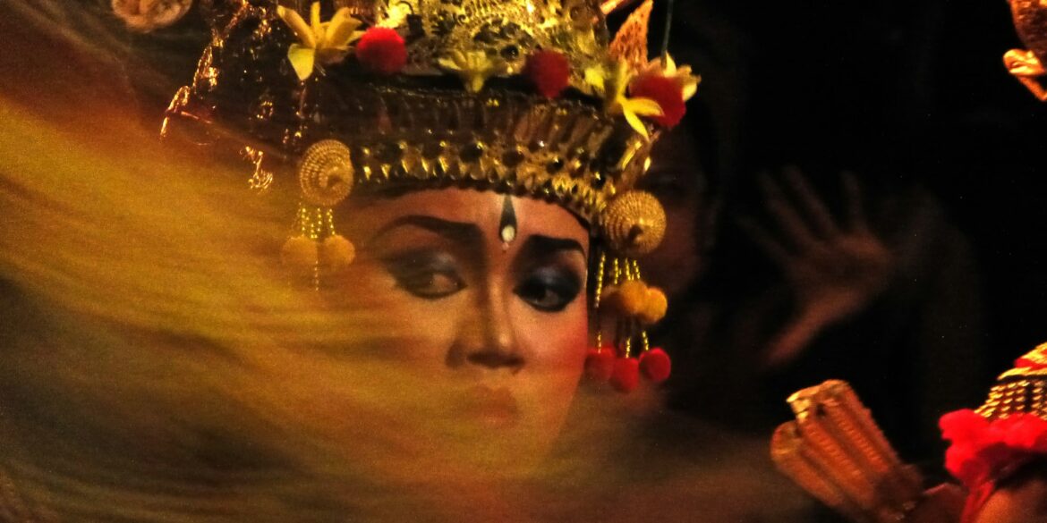 A woman wearing a headdress and a crown