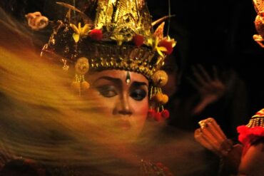 A woman wearing a headdress and a crown