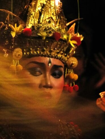 A woman wearing a headdress and a crown