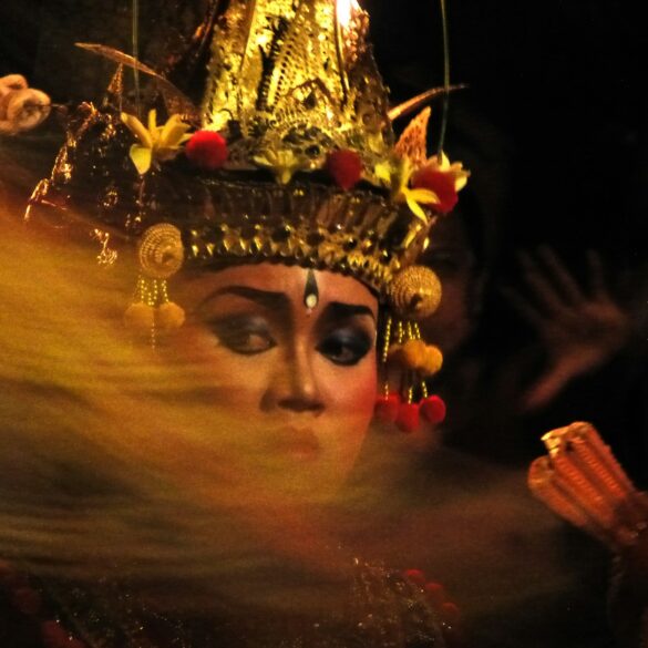 A woman wearing a headdress and a crown