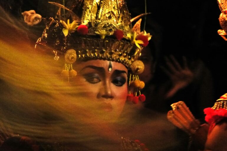 A woman wearing a headdress and a crown