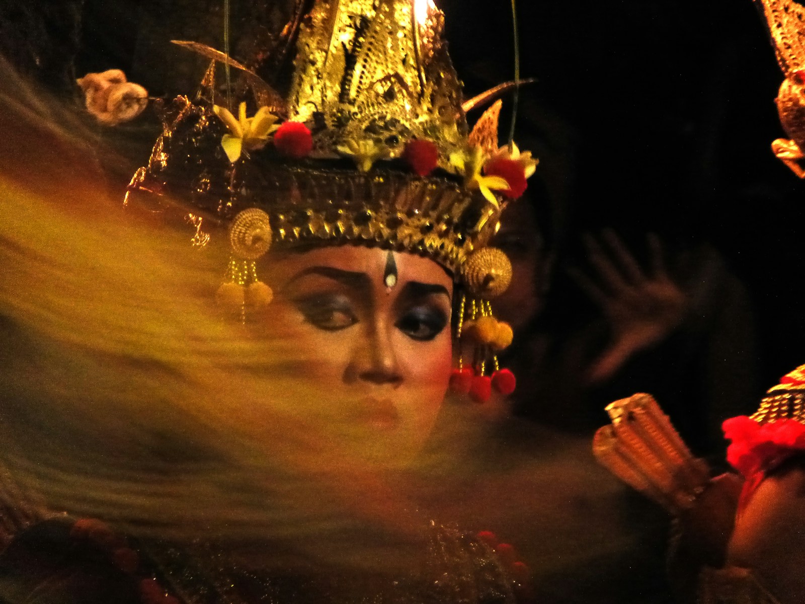 A woman wearing a headdress and a crown