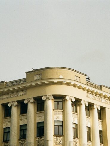 a large building with a clock on the front of it