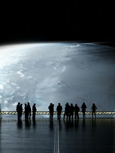 a group of people standing in a dark room