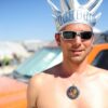 man wearing black sunglasses and silver crown