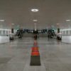 people walking on white floor tiles