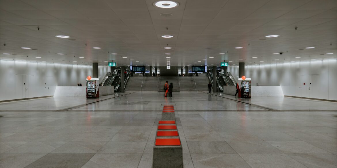 people walking on white floor tiles