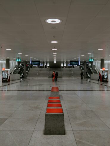 people walking on white floor tiles