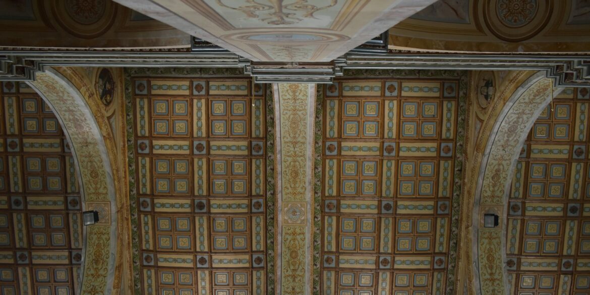 the ceiling of a building with decorative designs on it