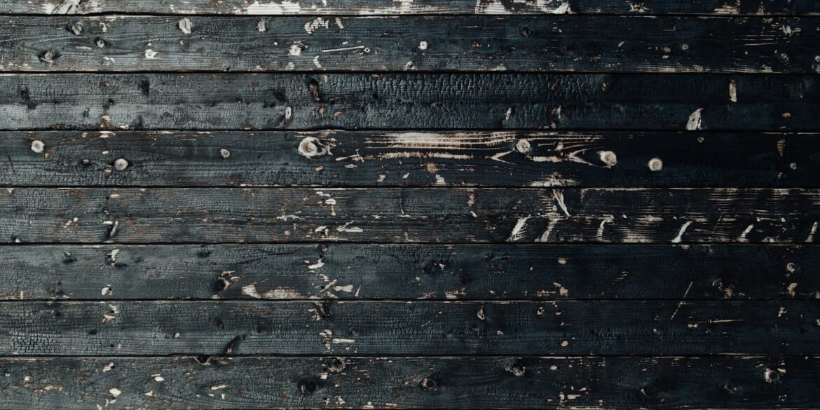 closeup photography of black wooden parquet partition