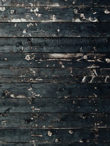 closeup photography of black wooden parquet partition