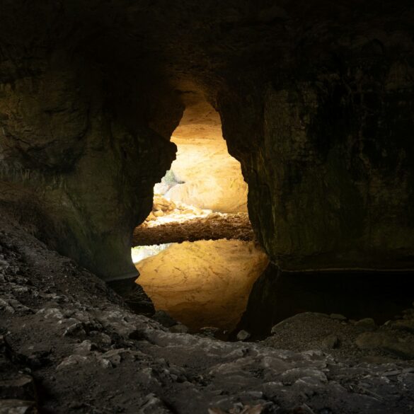 A cave with a light at the end of it