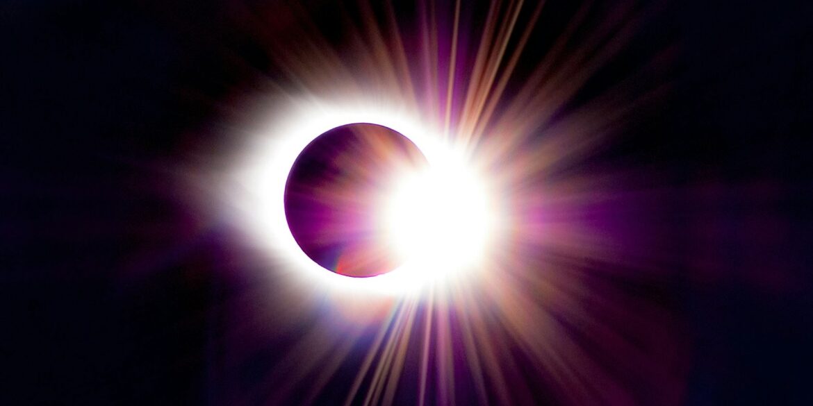 a solar eclipse is seen in the dark sky