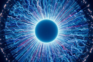 A close up of a blue eyeball in the dark