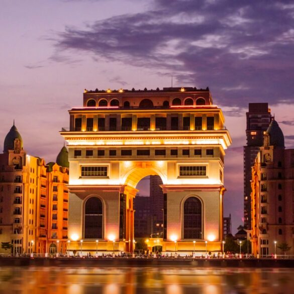 a large building with a body of water in front of it