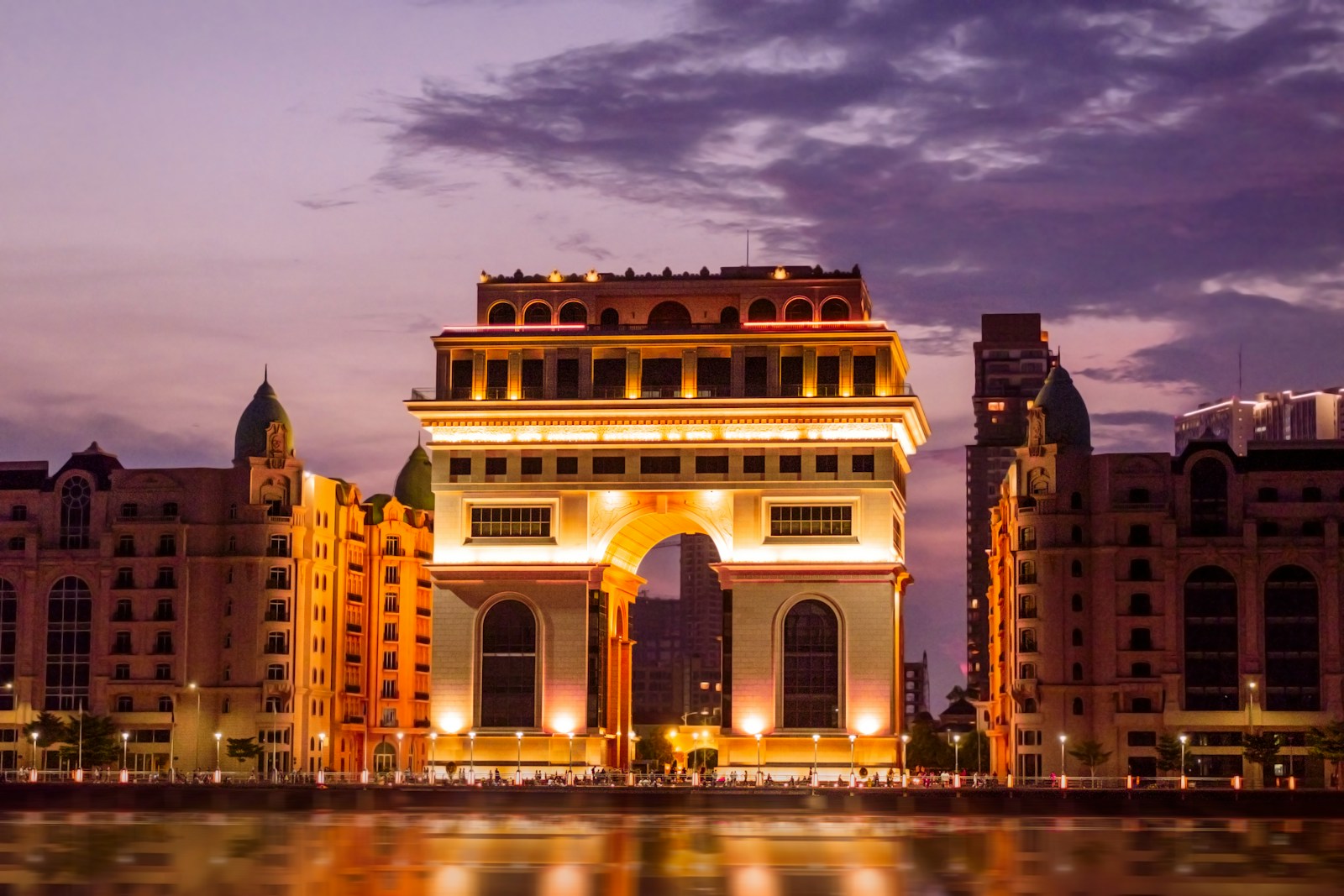 a large building with a body of water in front of it