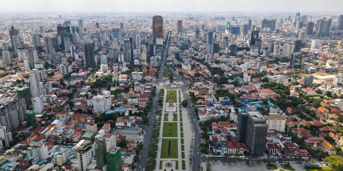 an aerial view of a city with tall buildings