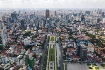 an aerial view of a city with tall buildings