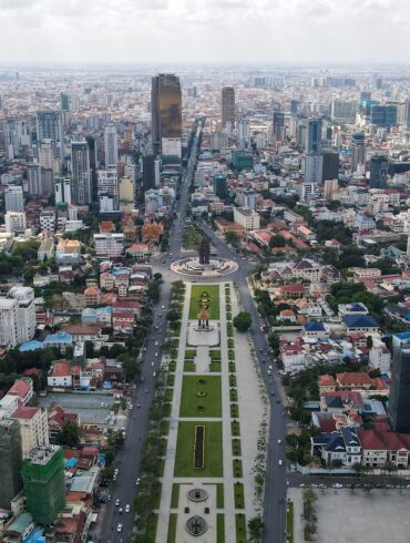 an aerial view of a city with tall buildings