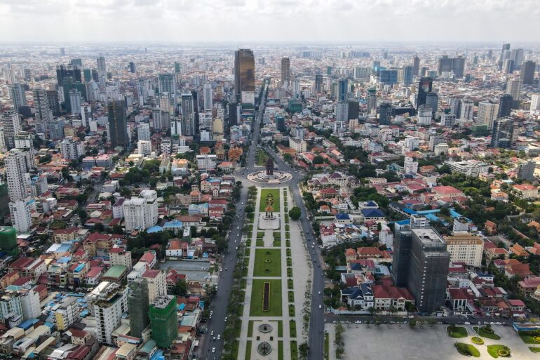 an aerial view of a city with tall buildings