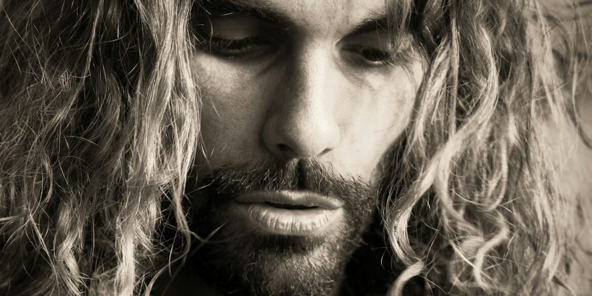 a man with long hair and a beard