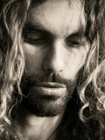 a man with long hair and a beard