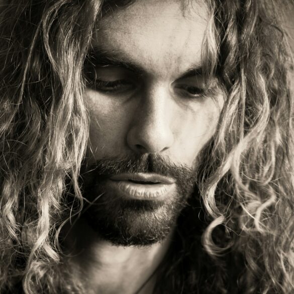 a man with long hair and a beard