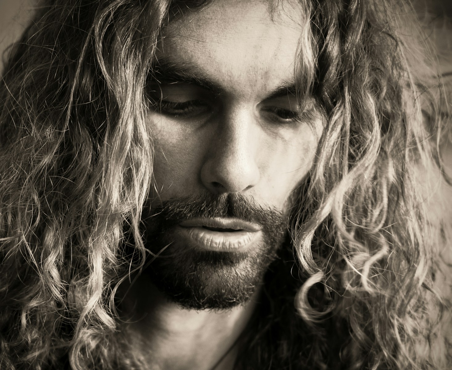 a man with long hair and a beard