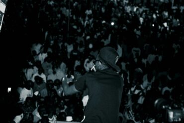 a man standing in front of a crowd of people