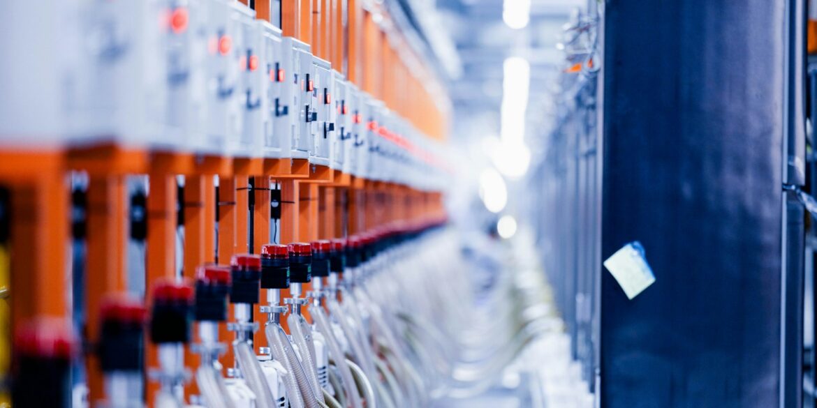 a row of orange and white electrical wires
