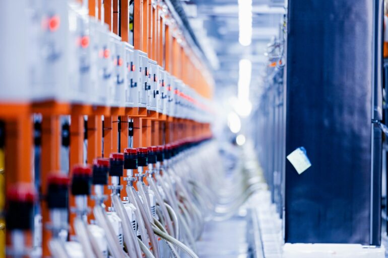 a row of orange and white electrical wires