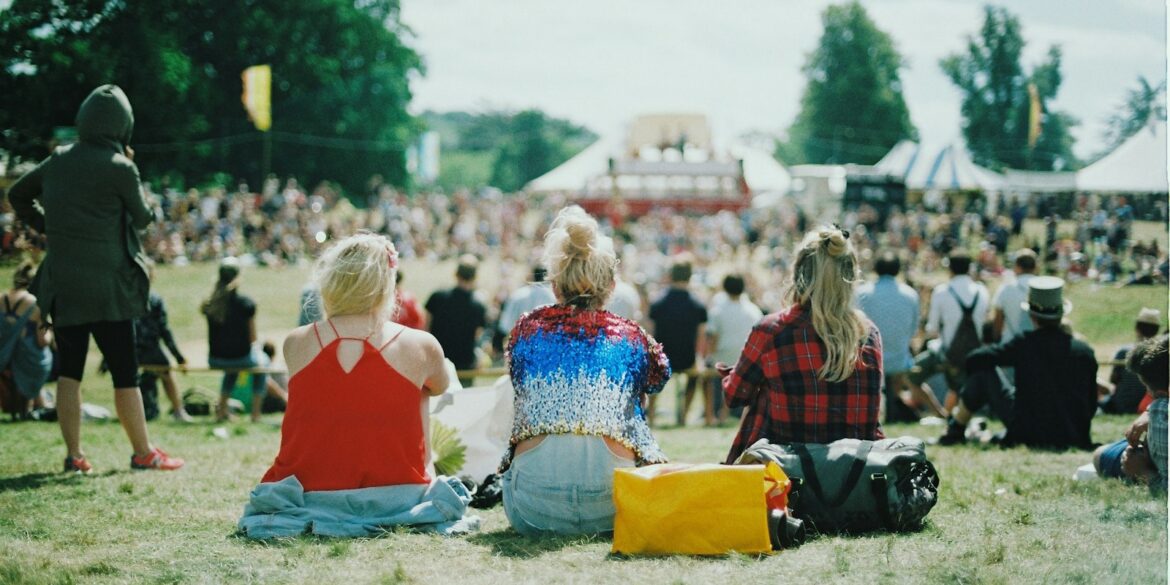 group of people on grass field under sunny day