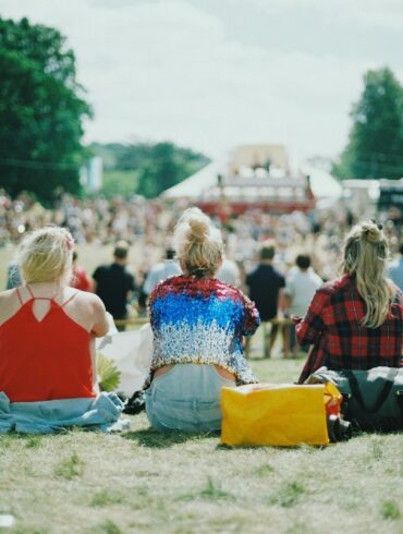 group of people on grass field under sunny day