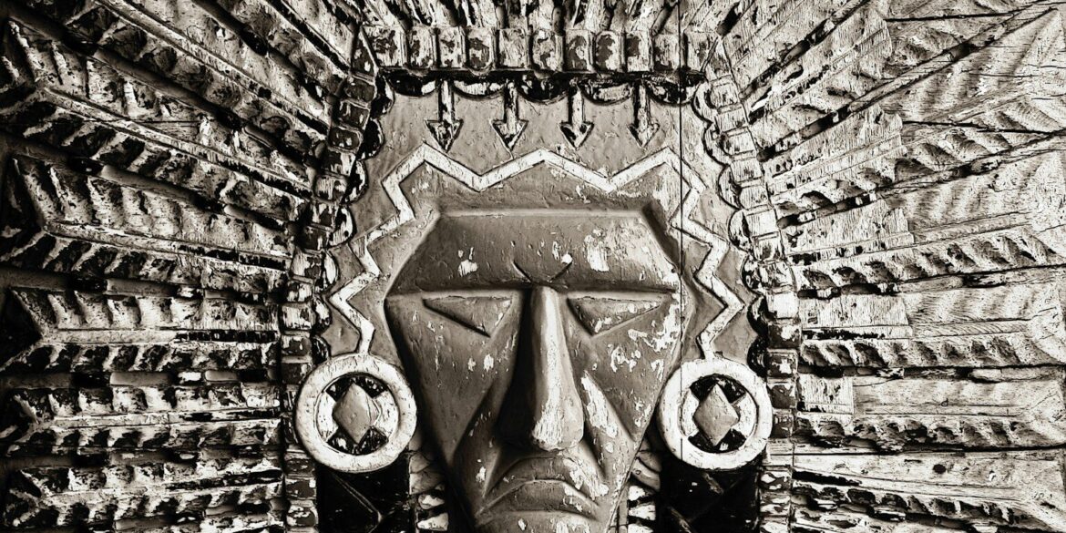 A carved stone native american chief's headdress