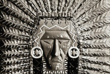 A carved stone native american chief's headdress