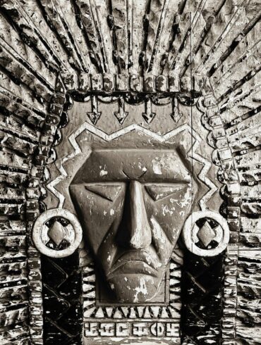 A carved stone native american chief's headdress
