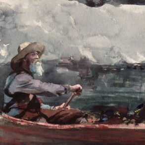 Man in canoe paddling through choppy water