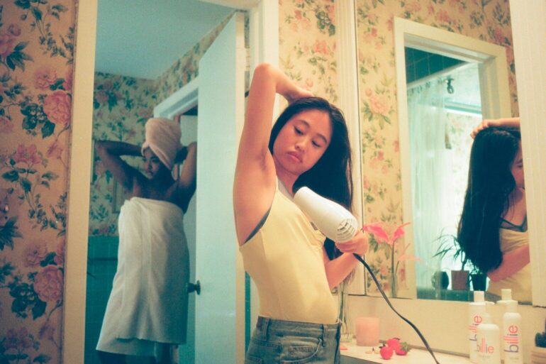 woman wearing white tank top