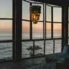 Modern room with ocean view at sunset