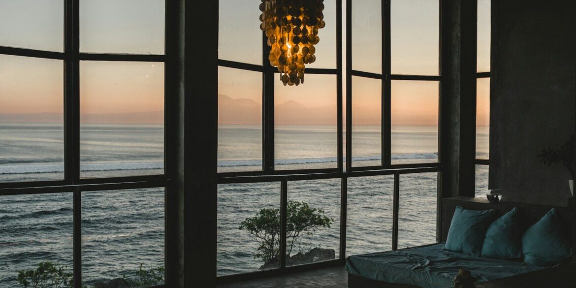 Modern room with ocean view at sunset